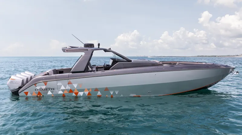  Yacht Photos Pics 2025 Cigarette 42 Auroris boat on open water under a clear sky.