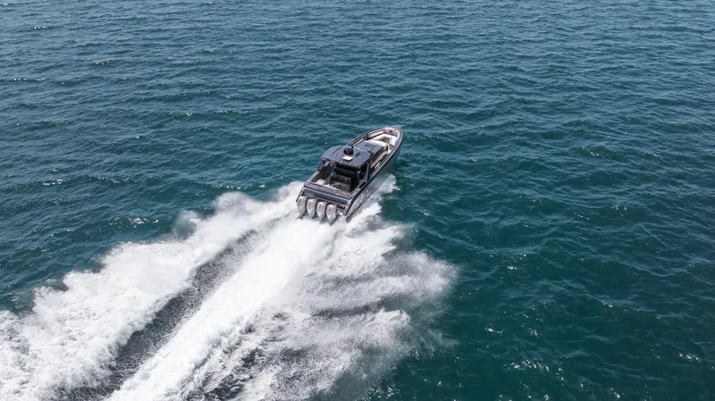  Yacht Photos Pics Aerial view of 2025 Cigarette 42 Auroris speedboat cruising on open water.