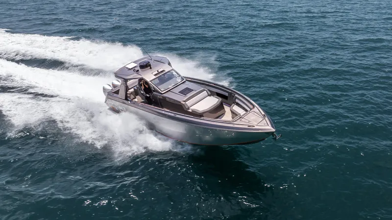  Yacht Photos Pics 2025 Cigarette 42 Auroris speedboat cruising on open water.