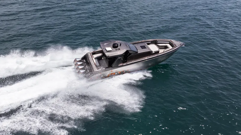  Yacht Photos Pics 2025 Cigarette 42 Auroris speedboat cruising on open water.