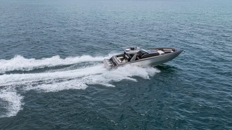  Yacht Photos Pics 2025 Cigarette 42 Auroris speedboat cruising on open water.