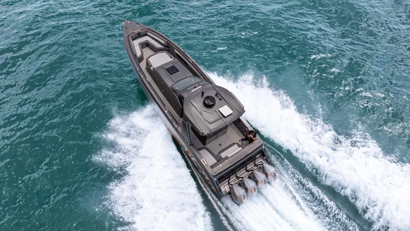  Yacht Photos Pics 2025 Cigarette 42 Auroris speedboat cruising on open water, aerial view.