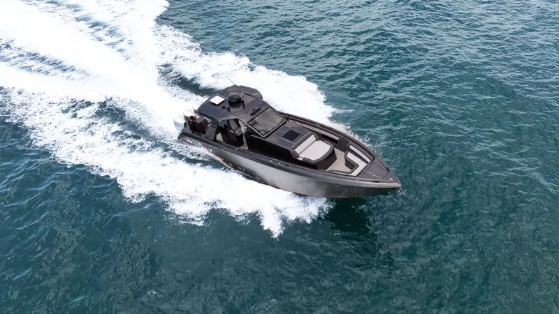  Yacht Photos Pics 2025 Cigarette 42 Auroris speedboat cruising on open water, showcasing sleek design and performance.