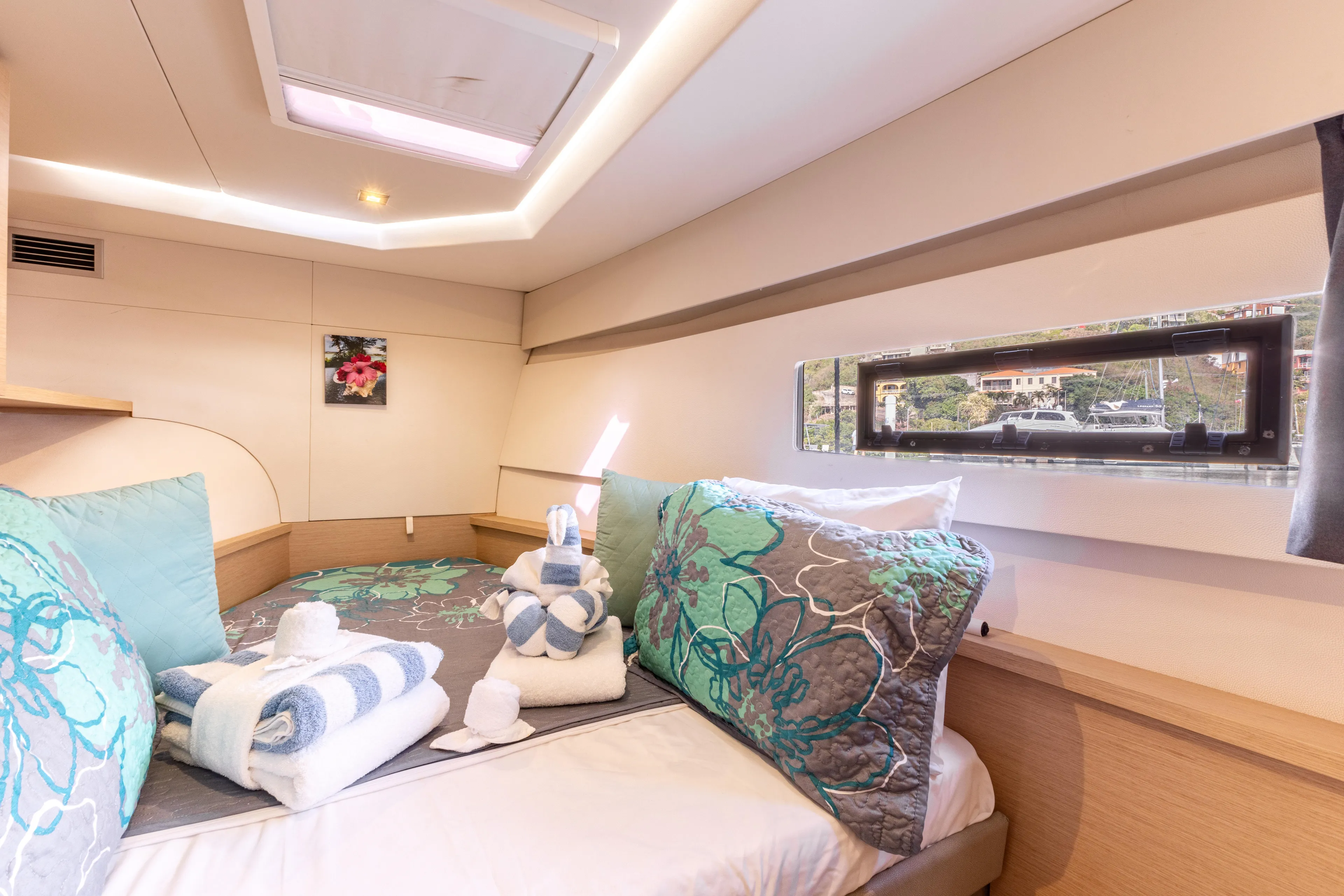  Yacht Photos Pics Luxurious cabin interior of 2019 Fountaine Pajot MY 37 with elegant bedding and window view.