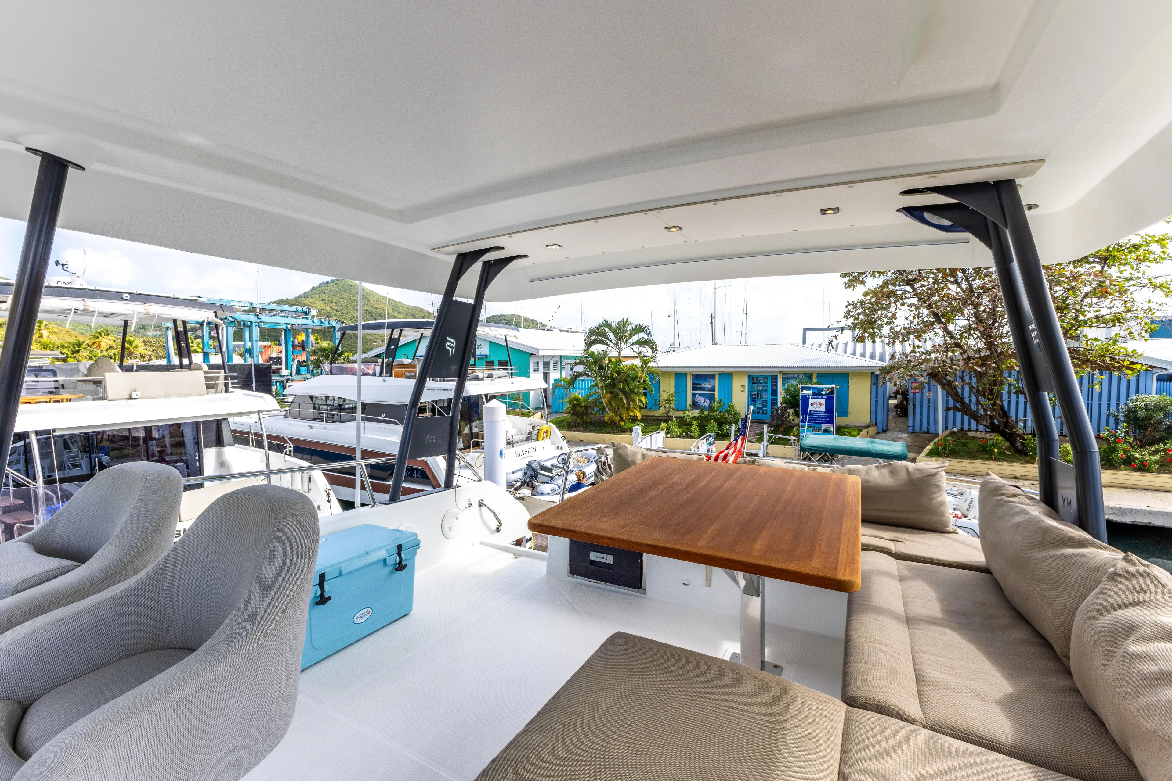 Yacht Photos Pics Fountaine Pajot MY 37 yacht interior with seating, table, and marina view, 2019 model.