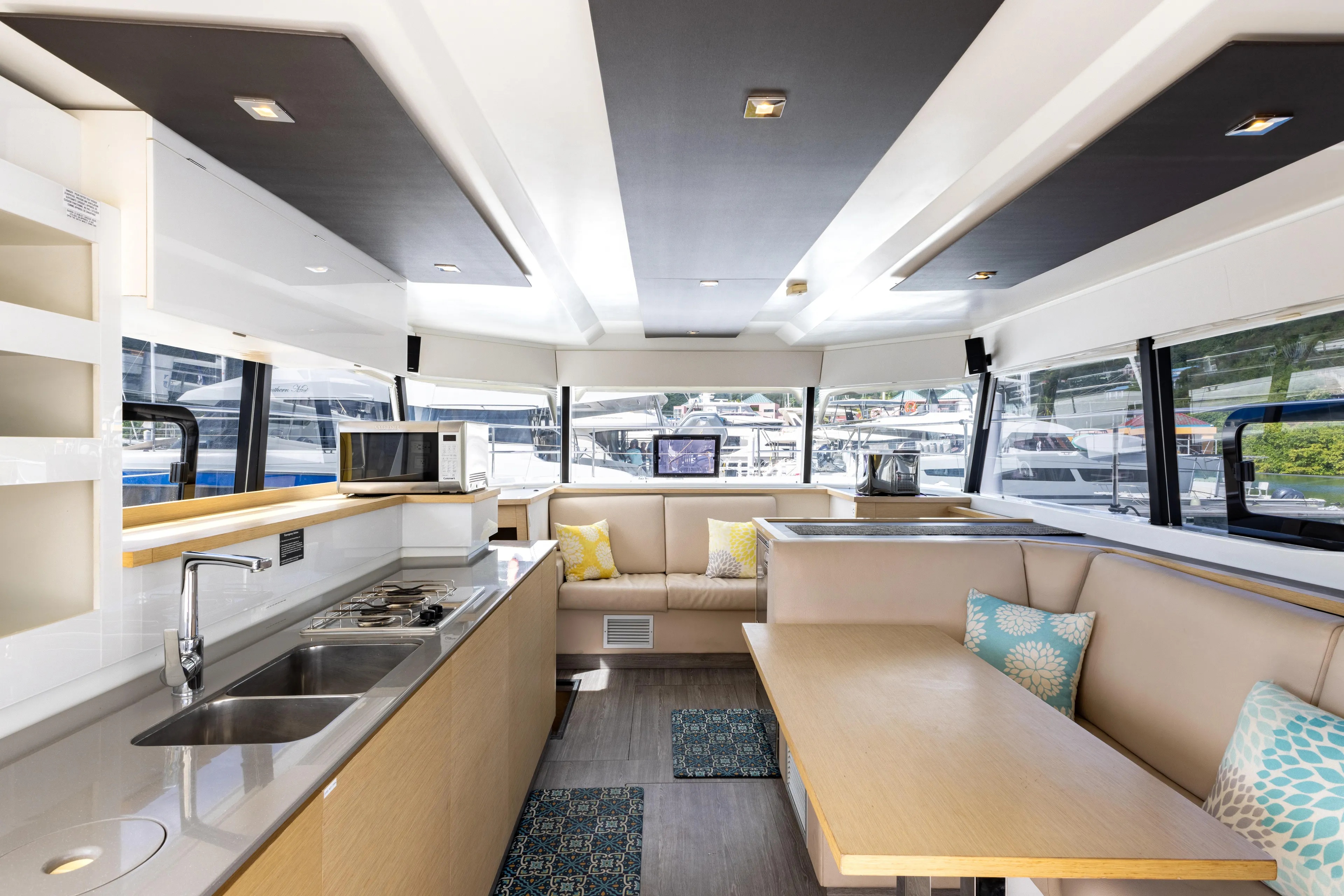  Yacht Photos Pics Luxurious interior of 2019 Fountaine Pajot MY 37 yacht with modern kitchen and seating area.