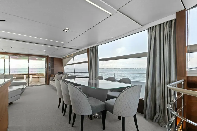 Amarula Sun Yacht Photos Pics Luxurious interior of 2018 Princess Y75 Motor Yacht with dining area and ocean view.