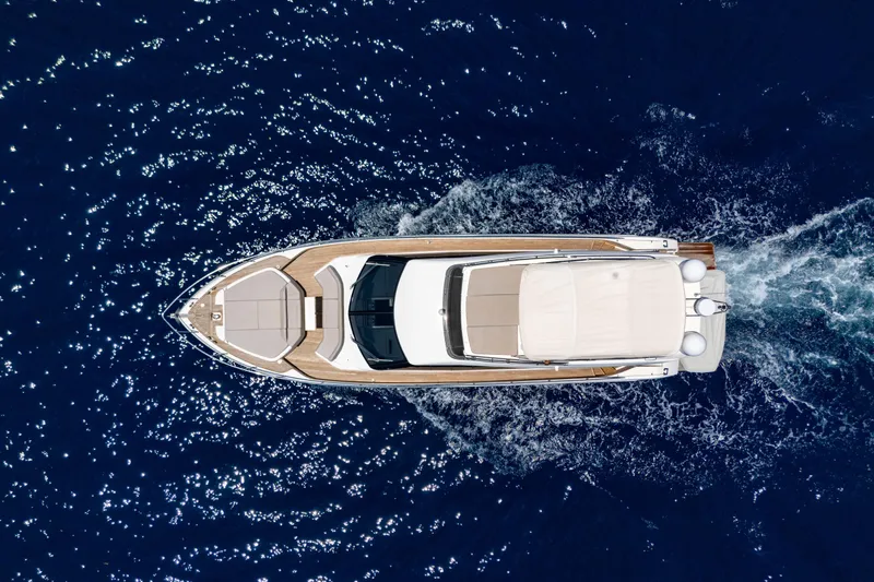 Dudu Yacht Photos Pics Aerial view of 2021 Ferretti Yachts 550 cruising on deep blue ocean.
