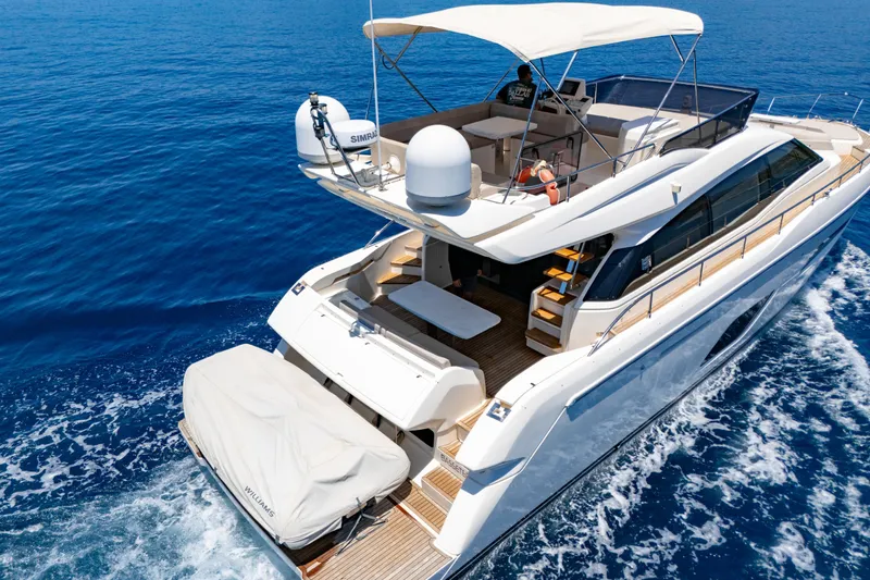 Dudu Yacht Photos Pics 2021 Ferretti Yachts 550 cruising on open sea, showcasing luxury design and spacious deck.