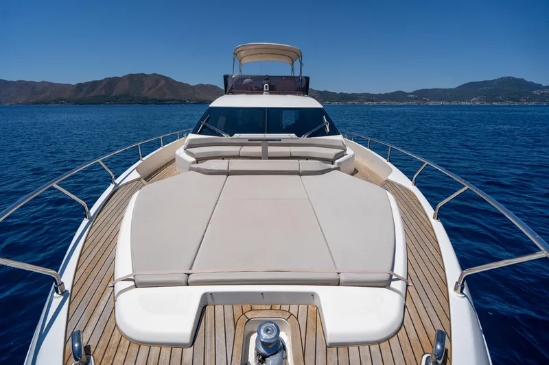 Dudu Yacht Photos Pics Ferretti Yachts 550, 2021 model, cruising on serene blue waters with scenic mountain backdrop.