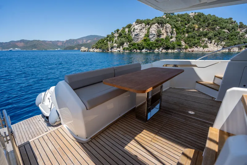 Dudu Yacht Photos Pics Luxurious 2021 Ferretti Yachts 550 deck with scenic ocean and island view.