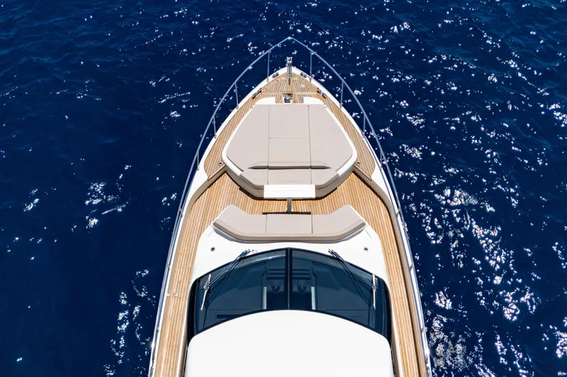 Dudu Yacht Photos Pics Aerial view of 2021 Ferretti Yachts 550 on sparkling blue water.