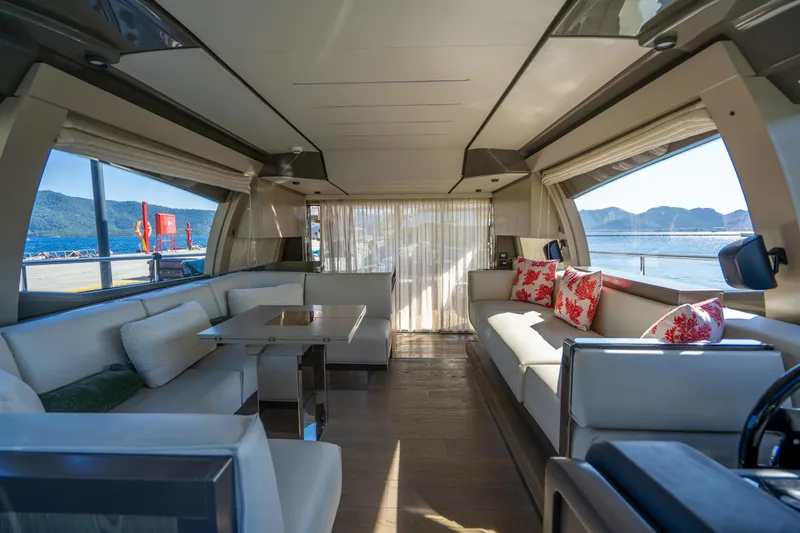 Dudu Yacht Photos Pics Luxurious interior of 2021 Ferretti Yachts 550 with elegant seating and scenic ocean views.
