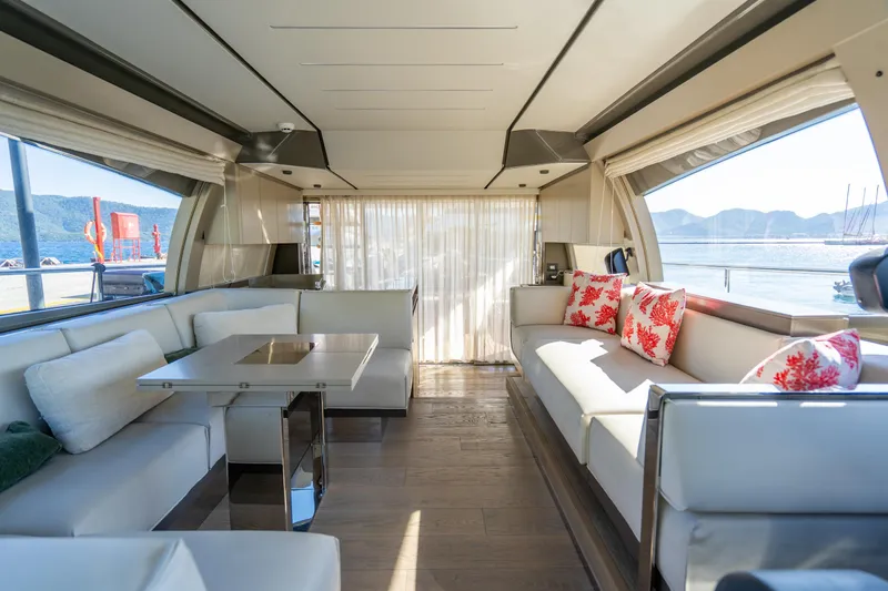 Dudu Yacht Photos Pics Luxurious interior of 2021 Ferretti Yachts 550 with elegant seating and scenic ocean views.