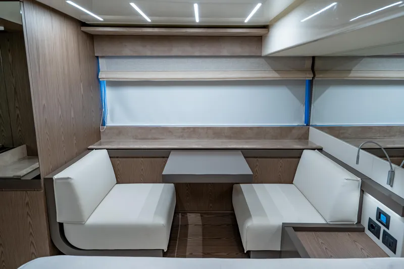 Dudu Yacht Photos Pics Interior of 2021 Ferretti Yachts 550, featuring modern seating and sleek design.