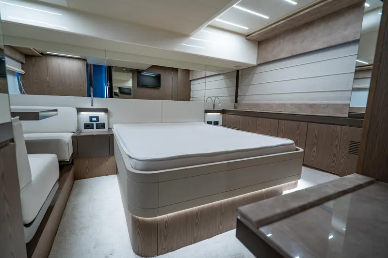 Dudu Yacht Photos Pics Luxurious bedroom interior of 2021 Ferretti Yachts 550, featuring modern design and ambient lighting.