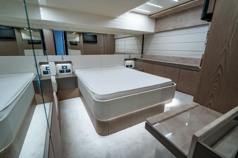 Dudu Yacht Photos Pics Luxurious bedroom interior of 2021 Ferretti Yachts 550 with modern design and elegant finishes.