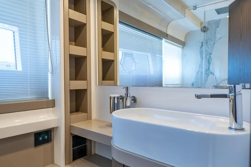 Dudu Yacht Photos Pics Luxurious bathroom interior of 2021 Ferretti Yachts 550 with modern fixtures and elegant design.