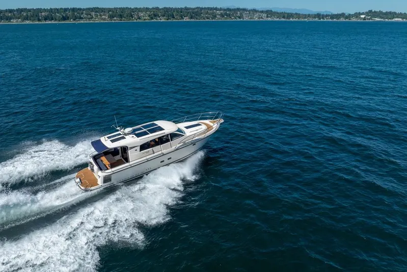Treasure State Yacht Photos Pics Nimbus 405 Coup&eacute; 2022 cruising on open water, showcasing sleek design and performance.