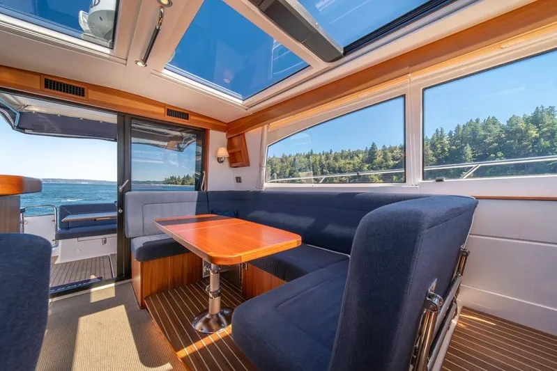 Treasure State Yacht Photos Pics Interior of 2022 Nimbus 405 Coup&eacute; yacht with panoramic windows and elegant seating.