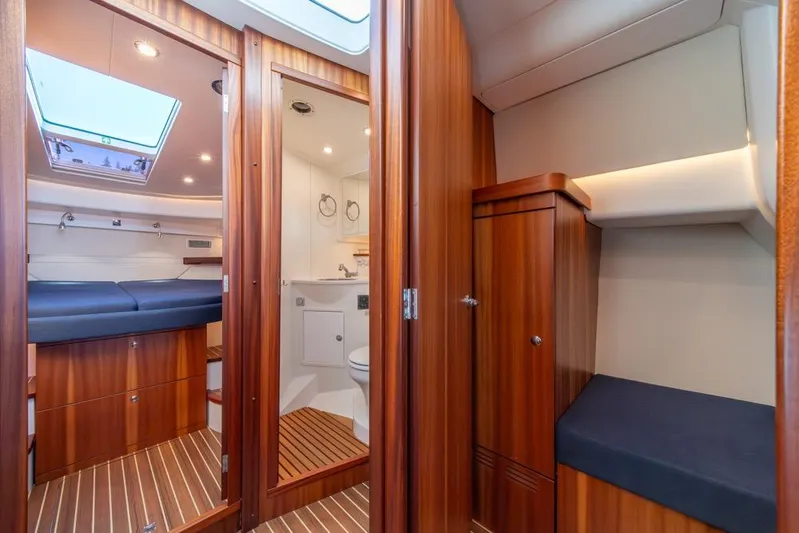 Treasure State Yacht Photos Pics Luxurious interior of 2022 Nimbus 405 Coup&eacute; yacht with wood finish and modern amenities.