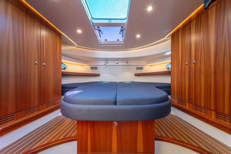 Treasure State Yacht Photos Pics Luxurious interior of 2022 Nimbus 405 Coup&eacute; yacht with wood finish and skylight.