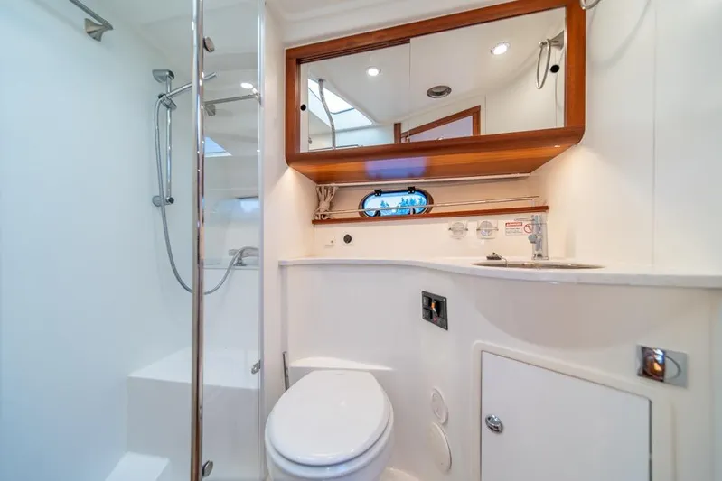 Treasure State Yacht Photos Pics Luxurious bathroom in 2022 Nimbus 405 Coup&eacute; yacht with shower and modern fixtures.