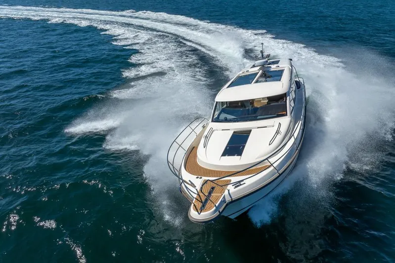 Treasure State Yacht Photos Pics 2022 Nimbus 405 Coup&eacute; yacht cruising swiftly on open blue waters.