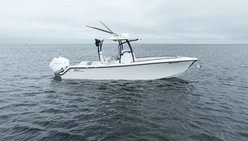  Yacht Photos Pics 2024 Streamline 26 CC boat on calm water, side view.