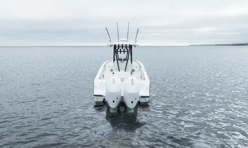  Yacht Photos Pics 2024 Streamline 26 CC boat on calm water, rear view with dual engines.