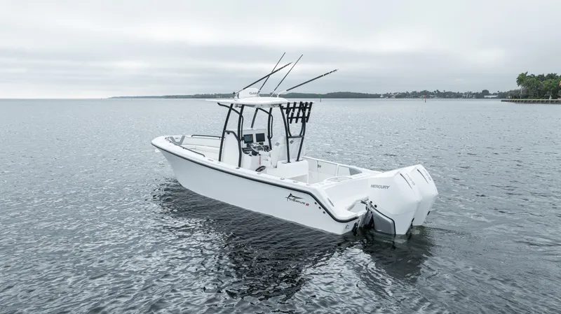 Yacht Photos Pics 2024 Streamline 26 CC boat on calm water, featuring sleek design and modern outboard engines.