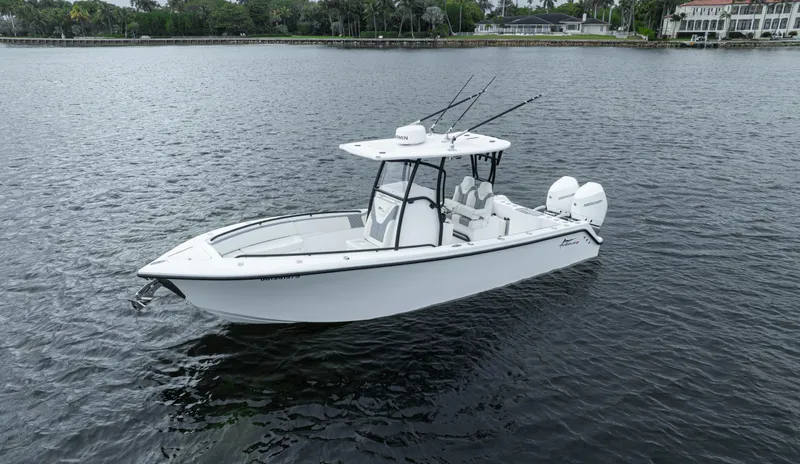  Yacht Photos Pics 2024 Streamline 26 CC boat on calm water, featuring sleek design and dual engines.