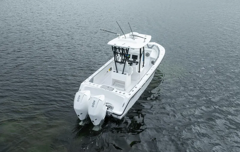  Yacht Photos Pics 2024 Streamline 26 CC boat with dual outboard engines on calm water.