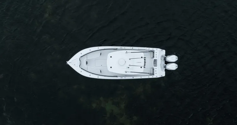 Yacht Photos Pics Aerial view of 2024 Streamline 26 CC boat on dark water.
