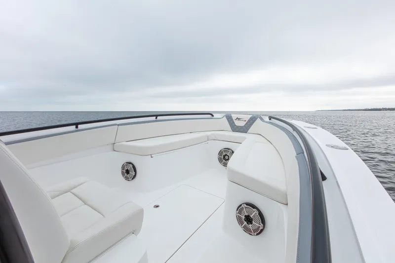  Yacht Photos Pics 2024 Streamline 26 CC boat with sleek white seating and ocean view.