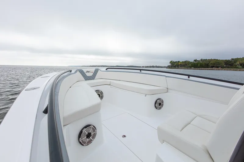  Yacht Photos Pics 2024 Streamline 26 CC boat with white seating, on calm water.