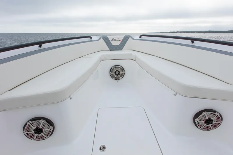  Yacht Photos Pics 2024 Streamline 26 CC boat interior with cushioned seating and speakers, overlooking the ocean.
