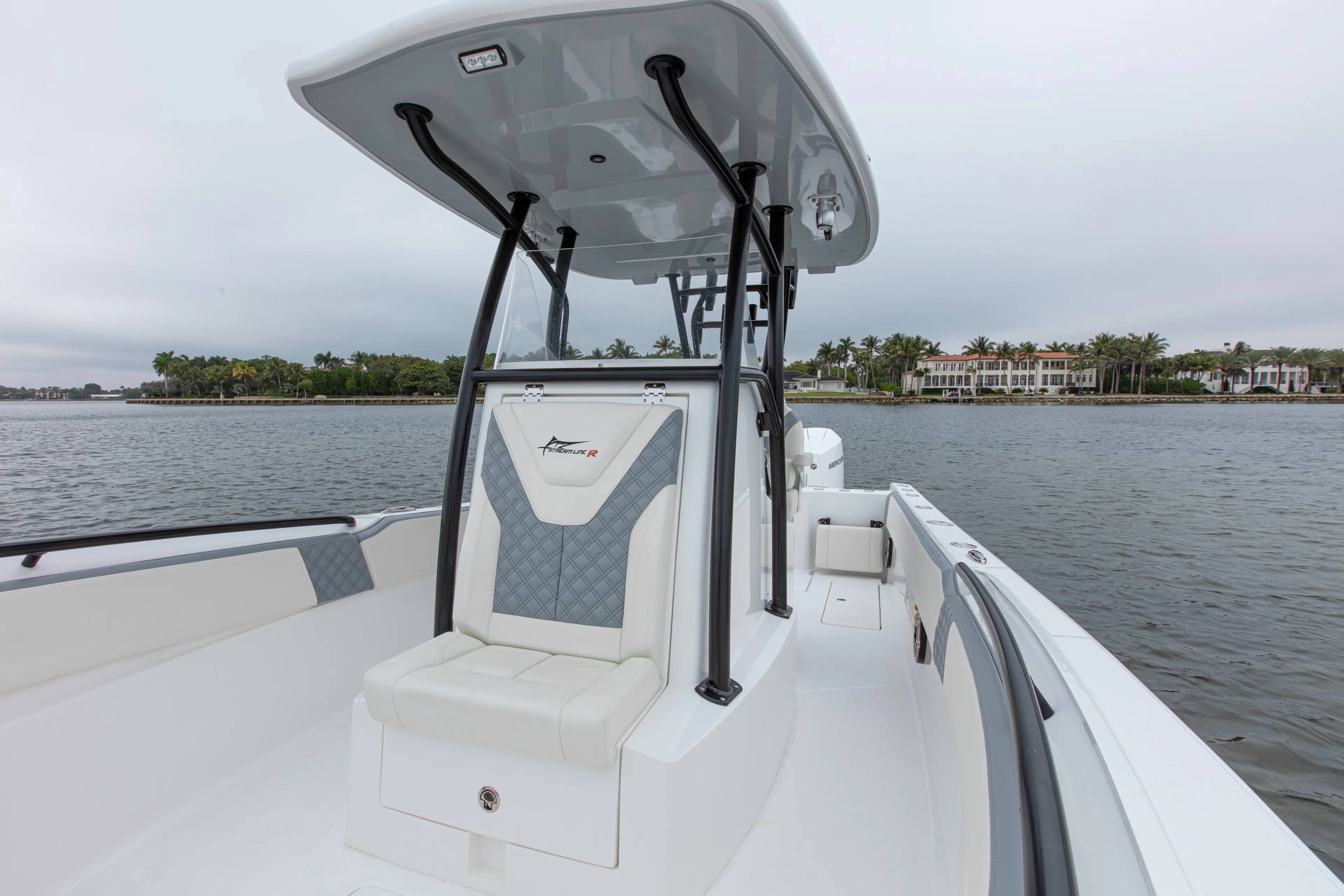  Yacht Photos Pics 2024 Streamline 26 CC boat on water, featuring sleek design and spacious seating.