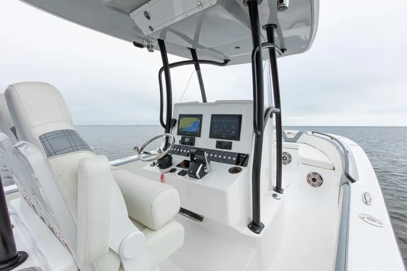  Yacht Photos Pics 2024 Streamline 26 CC boat interior with modern controls and seating on open water.