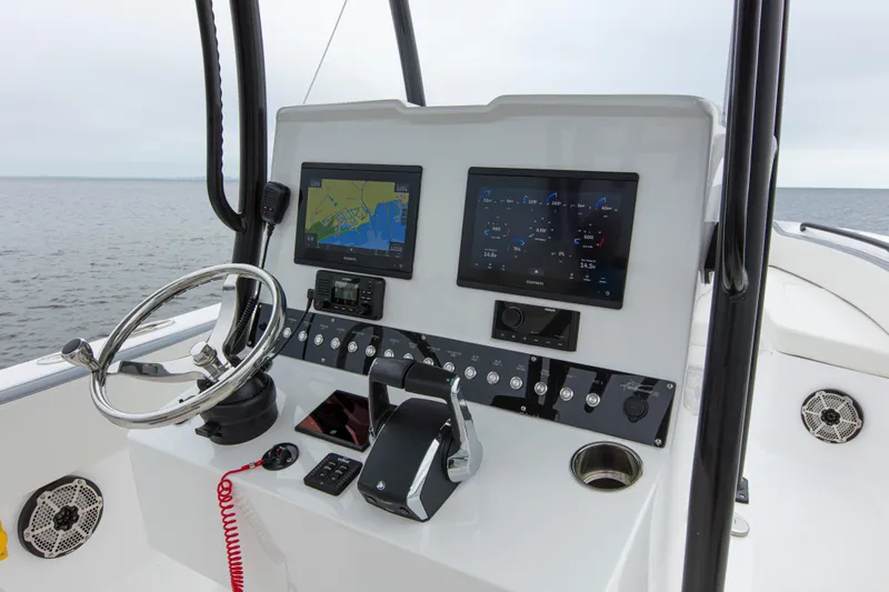  Yacht Photos Pics 2024 Streamline 26 CC boat dashboard with navigation screens and steering wheel.