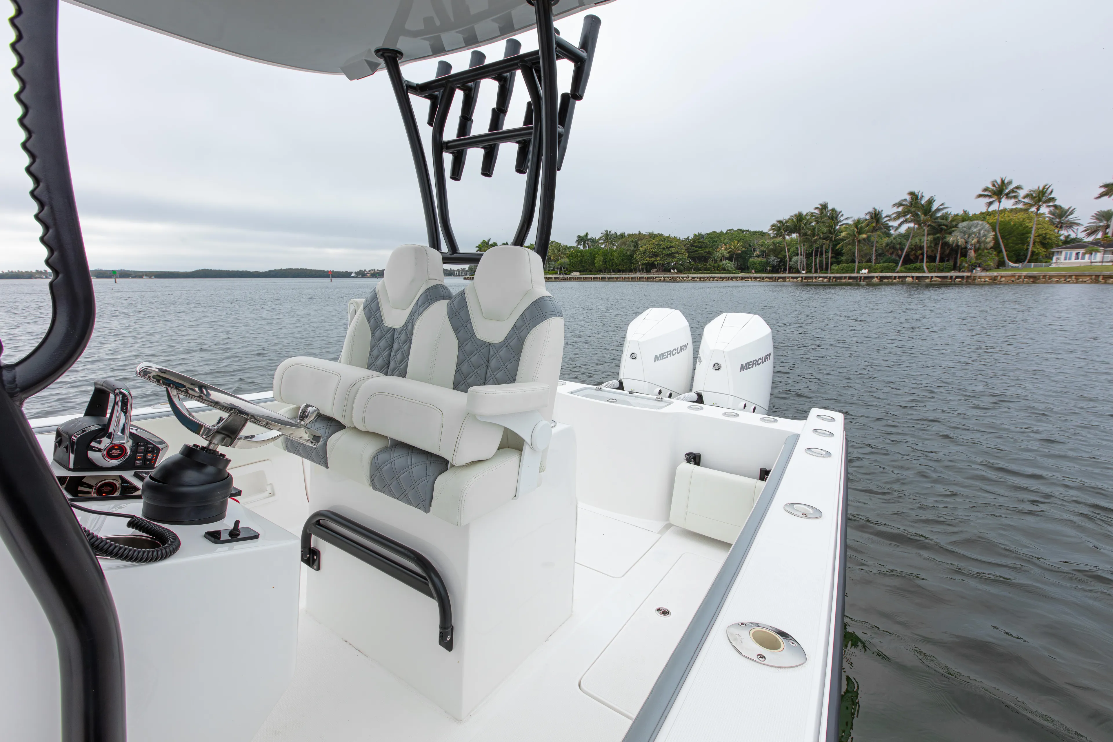  Yacht Photos Pics 2024 Streamline 26 CC boat with dual engines on a calm waterway.