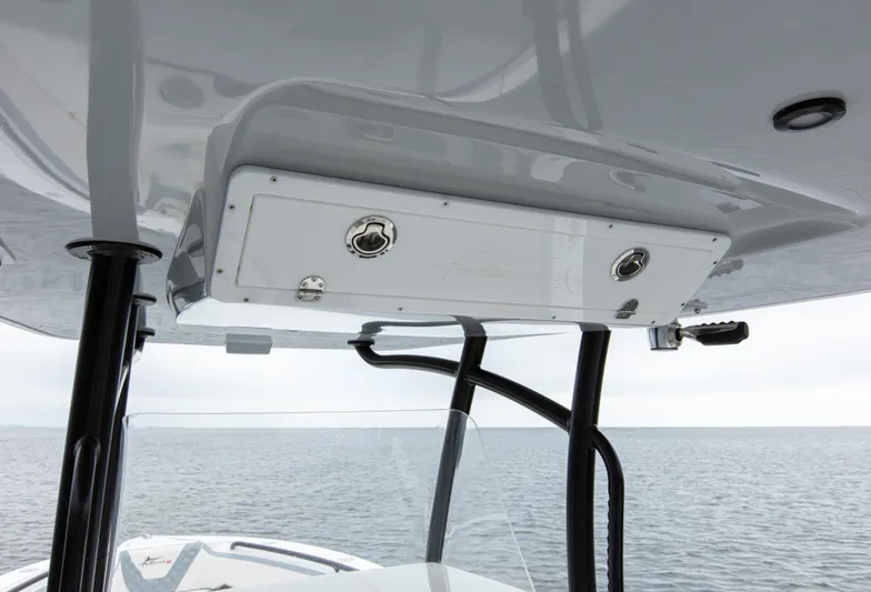  Yacht Photos Pics 2024 Streamline 26 CC boat console with storage compartment, viewed from below on open water.
