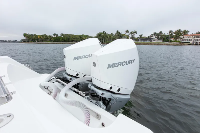  Yacht Photos Pics 2024 Streamline 26 CC boat with dual Mercury outboard engines on a calm waterway.