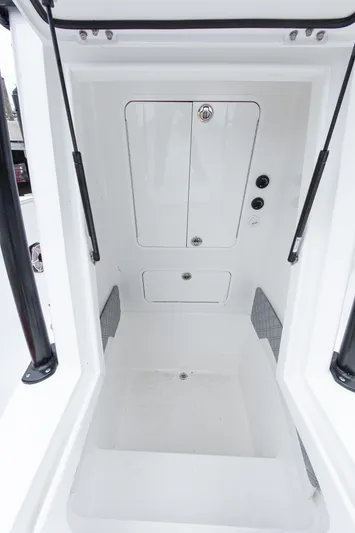  Yacht Photos Pics 2024 Streamline 26 CC boat interior with storage compartments and sleek design.