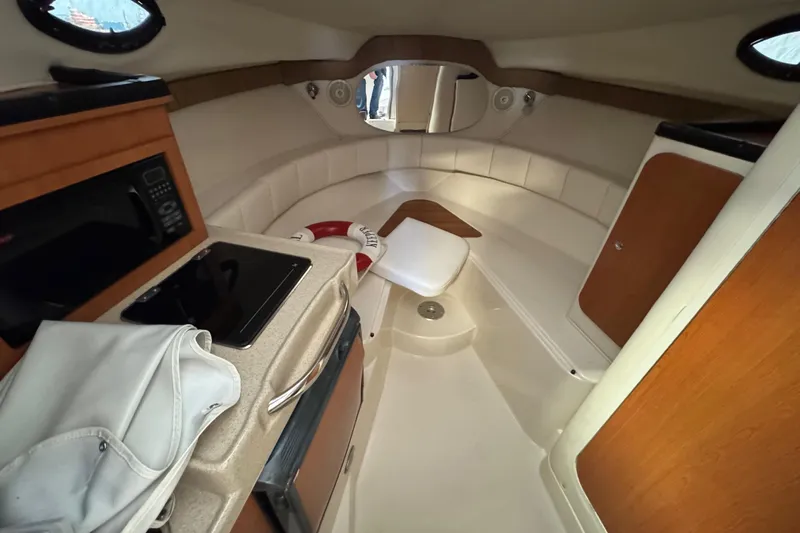  Yacht Photos Pics Interior of 2009 Wellcraft 270 Coastal O/B boat with kitchenette and seating area.