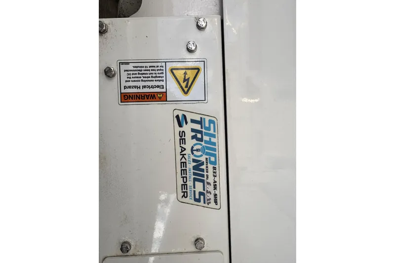  Yacht Photos Pics 2009 Wellcraft 270 Coastal O/B with Seakeeper and electrical hazard warning label.