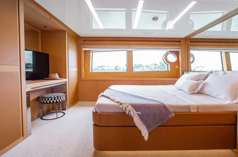 Lady Elkie Yacht Photos Pics Luxurious bedroom interior of 2016 Riva 88' Florida yacht with modern decor.