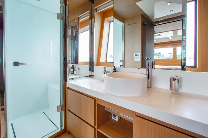 Lady Elkie Yacht Photos Pics Luxurious bathroom interior on 2016 Riva 88' Florida yacht, featuring modern fixtures and elegant design.