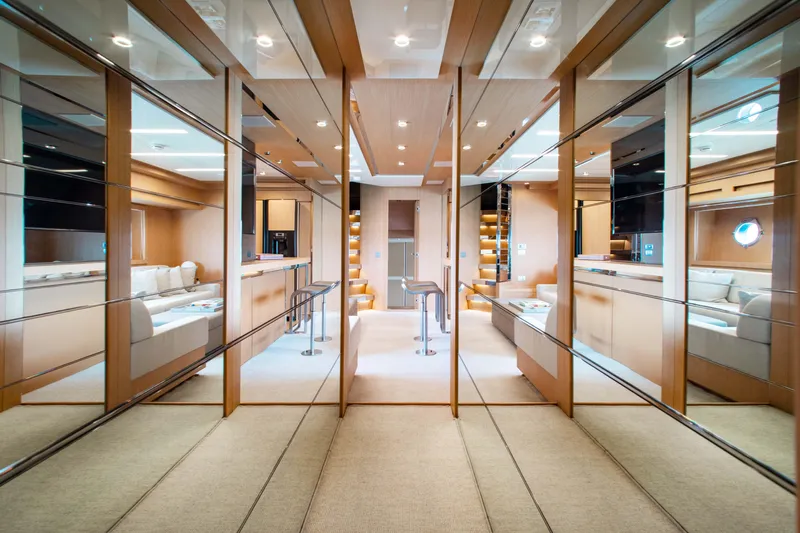 Lady Elkie Yacht Photos Pics Luxurious interior of 2016 Riva 88' Florida yacht with mirrored walls and elegant design.