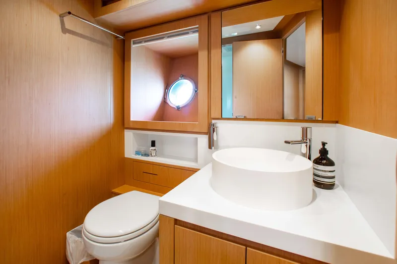 Lady Elkie Yacht Photos Pics Luxurious bathroom interior of 2016 Riva 88' Florida yacht with modern fixtures.